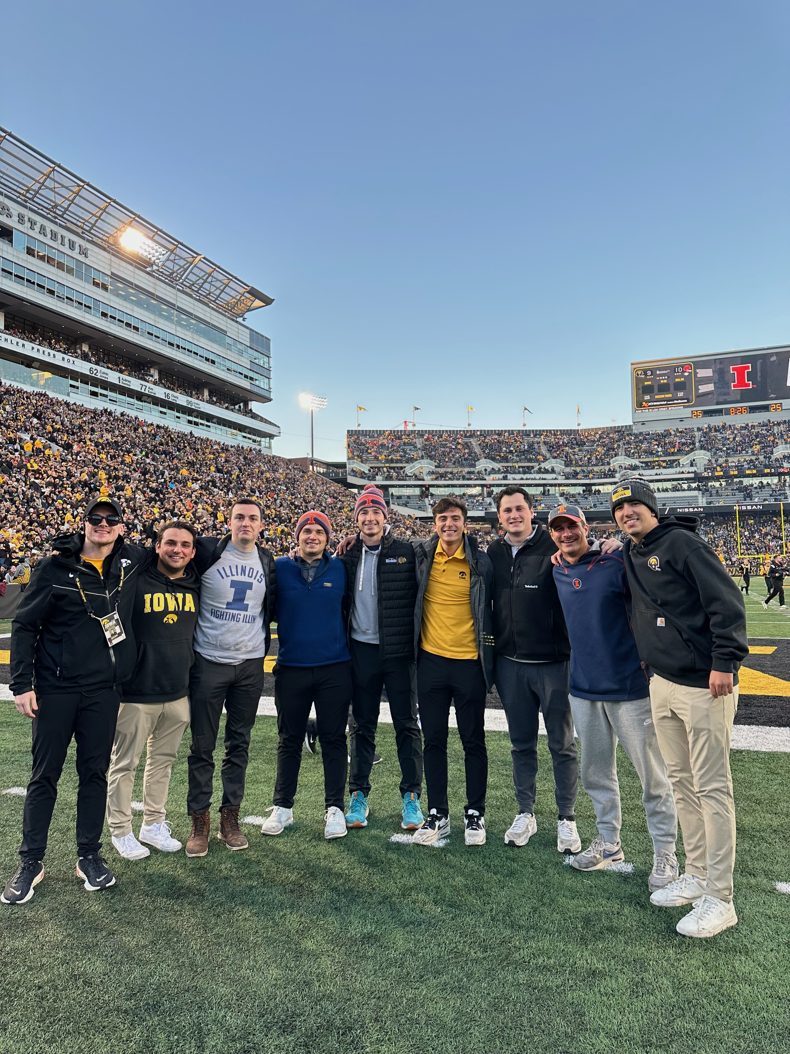 Photo of me and my Hometown/Iowa friends on the feild at Kinnick